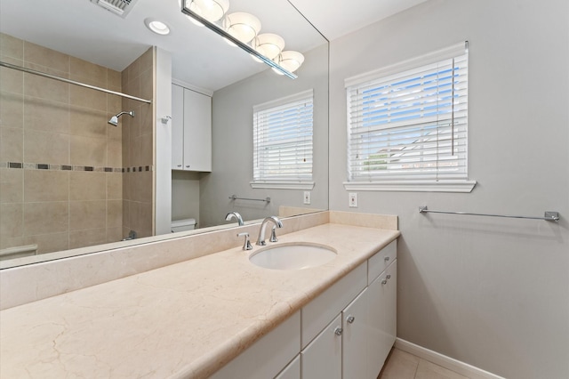 7545 Brompton St Unit 7545, Houston, TX 77025 - full bath featuring toilet, a tile shower, vanity, and baseboards