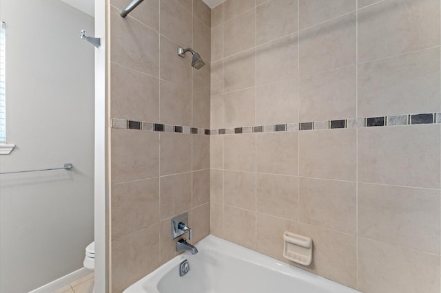 7545 Brompton St Unit 7545, Houston, TX 77025 - bathroom featuring toilet, shower / bath combination, and baseboards