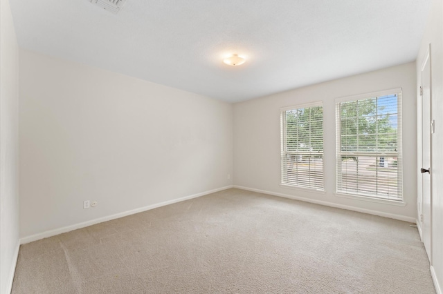 7545 Brompton St Unit 7545, Houston, TX 77025 - empty room with light colored carpet and baseboards