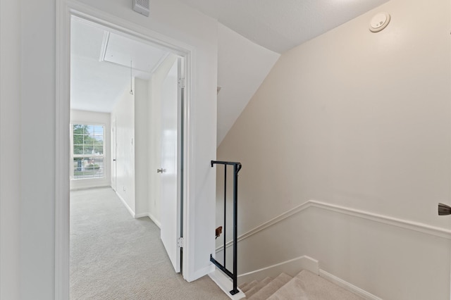 7545 Brompton St Unit 7545, Houston, TX 77025 - staircase featuring attic access, carpet floors, baseboards, and lofted ceiling