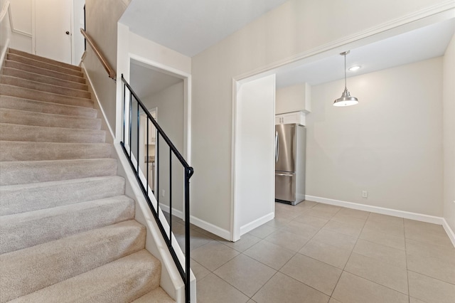 7545 Brompton St Unit 7545, Houston, TX 77025 - stairway featuring tile patterned floors, baseboards, and recessed lighting