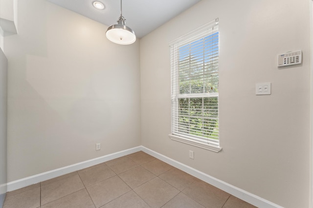 7545 Brompton St Unit 7545, Houston, TX 77025 - unfurnished room with plenty of natural light, baseboards, and light tile patterned floors
