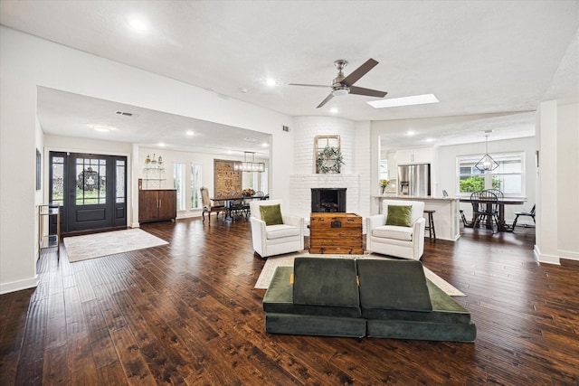 living room with visible vents, baseboards, dark wood-style floors, recessed lighting, and a ceiling fan