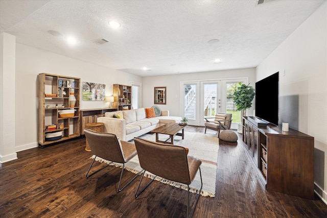 living area featuring a textured ceiling, recessed lighting, baseboards, visible vents, and dark wood-style floors