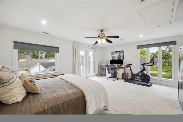 bedroom with attic access, access to exterior, visible vents, carpet, and recessed lighting