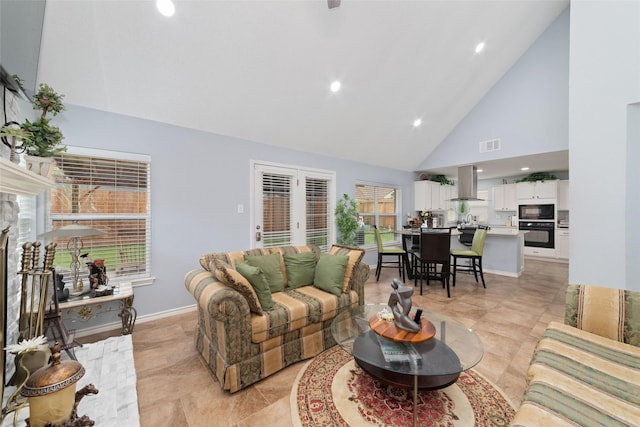 living room with high vaulted ceiling, baseboards, recessed lighting, and visible vents