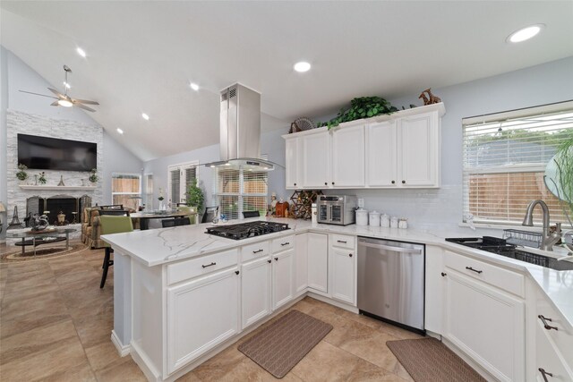 kitchen with ceiling fan, island range hood, black gas cooktop, a sink, and dishwasher