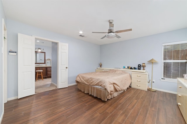 bedroom featuring baseboards, dark wood-style flooring, and visible vents