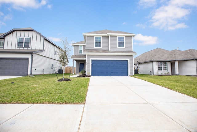 traditional-style home with central air condition unit, driveway, a front yard, and a garage