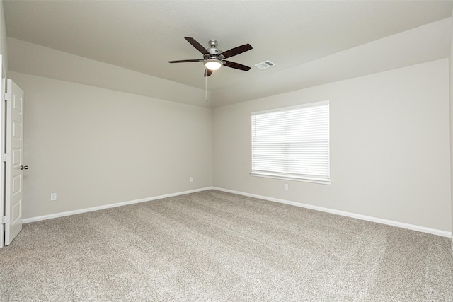 spare room featuring visible vents, a ceiling fan, baseboards, and carpet floors