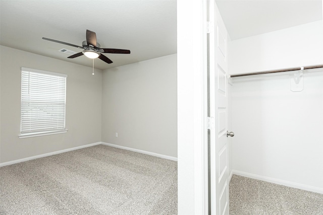 unfurnished bedroom featuring carpet flooring, baseboards, and ceiling fan