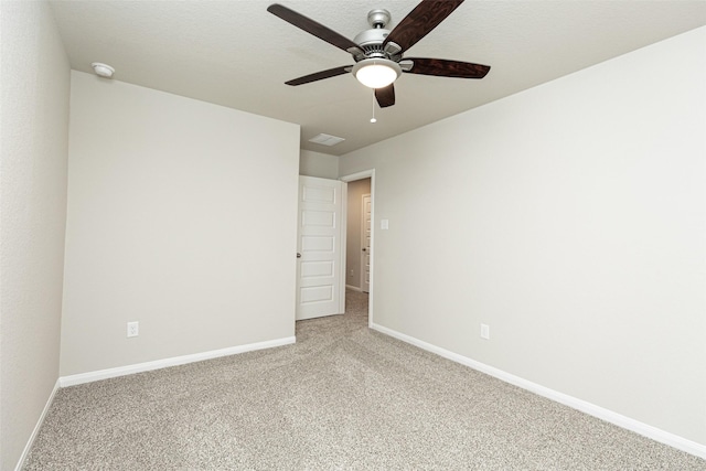 unfurnished bedroom featuring carpet flooring, a ceiling fan, baseboards, and visible vents