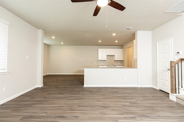 unfurnished living room featuring recessed lighting, ceiling fan, and light wood-style floors