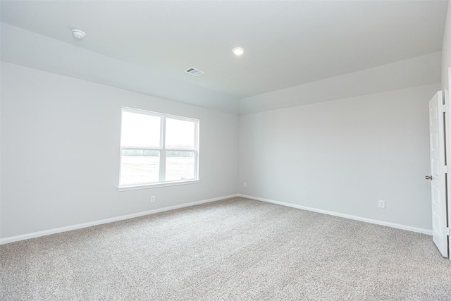 empty room with recessed lighting, baseboards, visible vents, and carpet