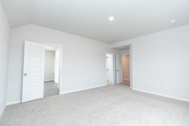 unfurnished bedroom with baseboards, recessed lighting, and light carpet