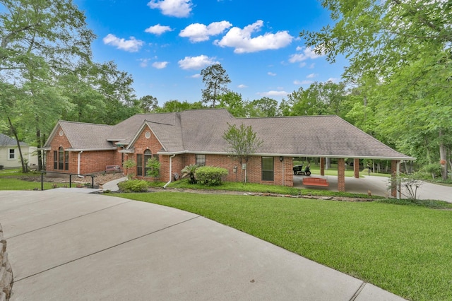 5 Highland Hollow Dr, Conroe, TX 77304 - view of front of property with brick siding, a front lawn, driveway, and roof with shingles