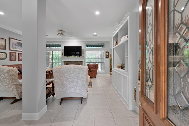 5 Highland Hollow Dr, Conroe, TX 77304 - living area with ornamental molding, light tile patterned flooring, a fireplace, recessed lighting, and baseboards