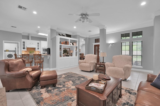 5 Highland Hollow Dr, Conroe, TX 77304 - living room featuring light tile patterned floors, washer / clothes dryer, ornamental molding, ceiling fan, and recessed lighting