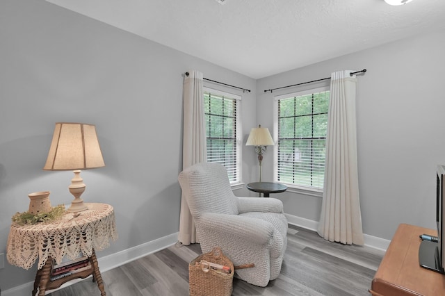 5 Highland Hollow Dr, Conroe, TX 77304 - sitting room with wood finished floors and baseboards