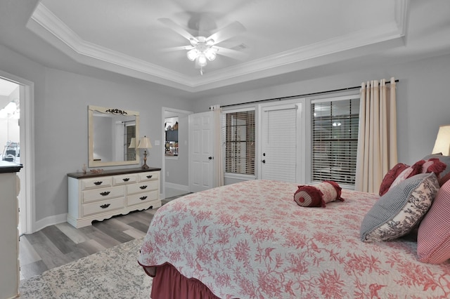5 Highland Hollow Dr, Conroe, TX 77304 - bedroom with a raised ceiling, crown molding, wood finished floors, baseboards, and access to outside