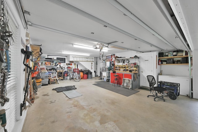 5 Highland Hollow Dr, Conroe, TX 77304 - garage with a workshop area and a garage door opener