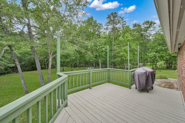 5 Highland Hollow Dr, Conroe, TX 77304 - deck featuring grilling area, a lawn, and view of scattered trees