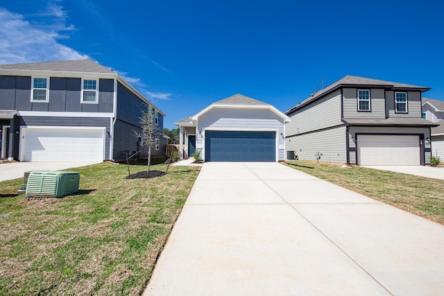 13609 Goldeye Dr, Conroe, TX 77384 - view of front of house with a garage, central AC unit, and a front yard