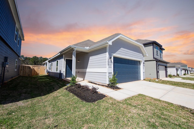 13609 Goldeye Dr, Conroe, TX 77384 - view of front of property featuring a garage, fence, driveway, a gate, and a yard