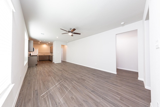 13609 Goldeye Dr, Conroe, TX 77384 - unfurnished living room featuring a ceiling fan, baseboards, recessed lighting, and wood finished floors