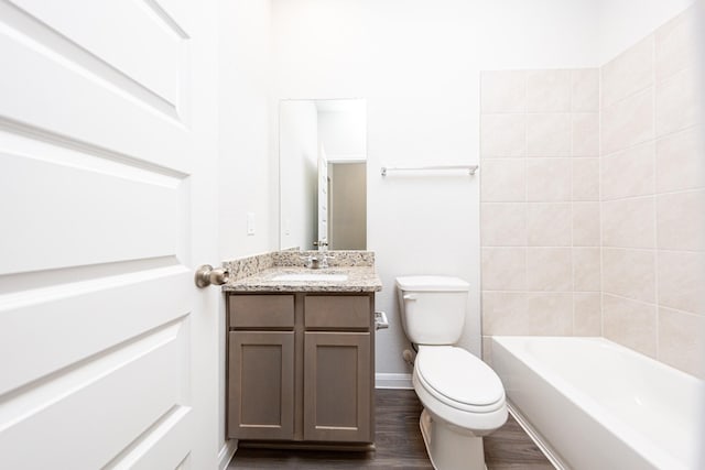 13609 Goldeye Dr, Conroe, TX 77384 - full bath with vanity, toilet, baseboards, shower / washtub combination, and wood finished floors