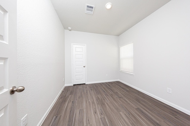 13609 Goldeye Dr, Conroe, TX 77384 - spare room with baseboards, dark wood finished floors, and visible vents