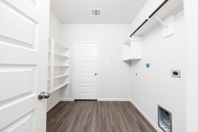 13609 Goldeye Dr, Conroe, TX 77384 - laundry area featuring dark wood-style flooring, laundry area, visible vents, and electric dryer hookup