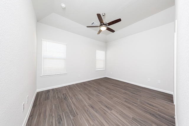13609 Goldeye Dr, Conroe, TX 77384 - spare room with baseboards, ceiling fan, dark wood-style flooring, and lofted ceiling