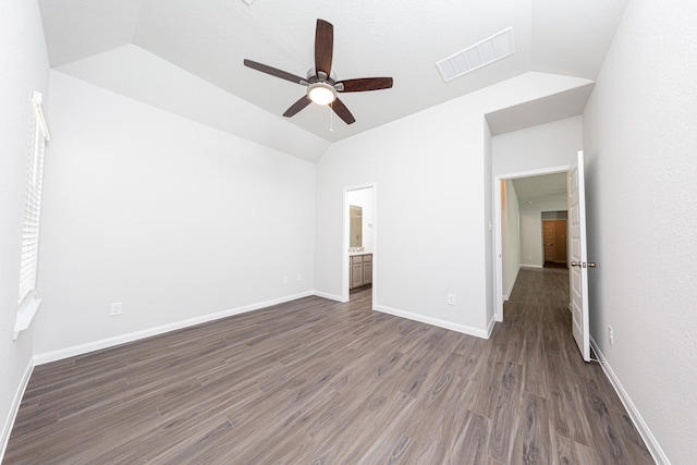 13609 Goldeye Dr, Conroe, TX 77384 - unfurnished bedroom featuring visible vents, lofted ceiling, baseboards, dark wood-type flooring, and a ceiling fan