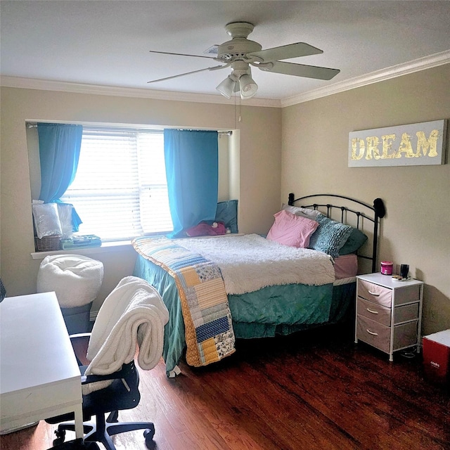 bedroom with crown molding, a ceiling fan, and wood finished floors
