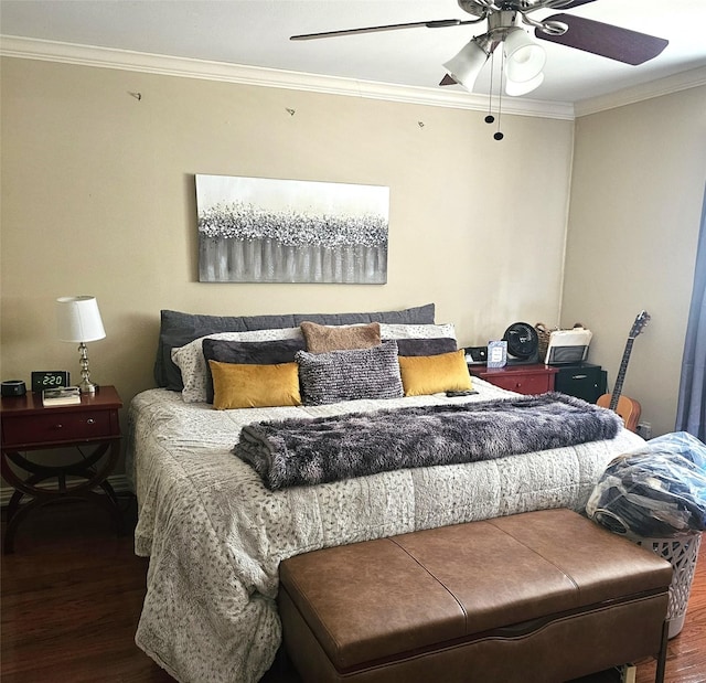 bedroom with ornamental molding, ceiling fan, and wood finished floors