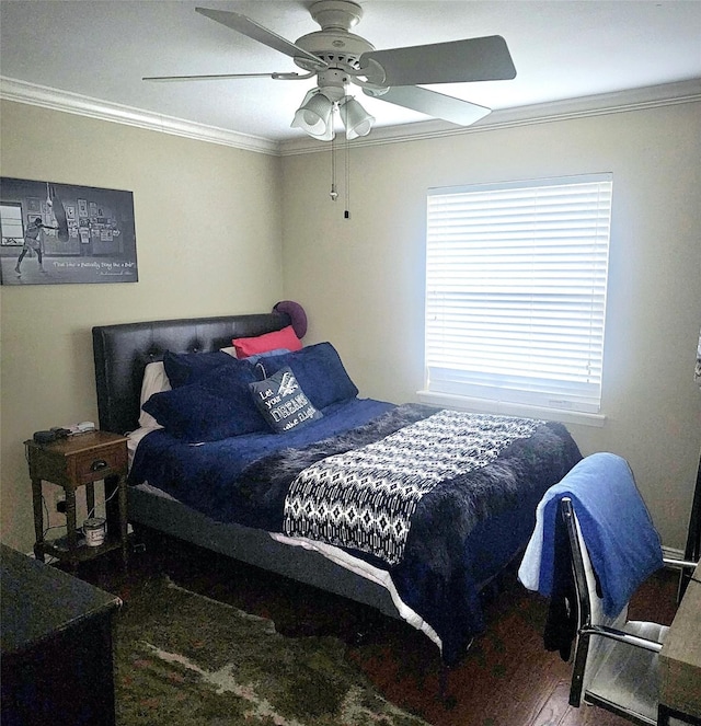 bedroom with crown molding, a ceiling fan, and wood finished floors