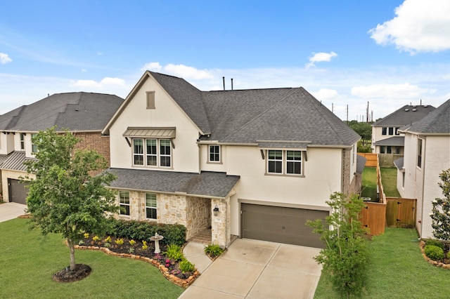 720 Serenity View Ln, Katy, TX 77493 - traditional home featuring a garage, fence, roof with shingles, stucco siding, and concrete driveway