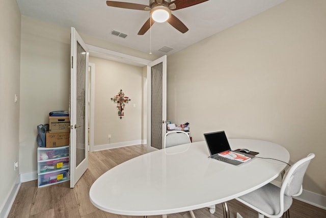 720 Serenity View Ln, Katy, TX 77493 - office space featuring baseboards, a ceiling fan, wood finished floors, and visible vents
