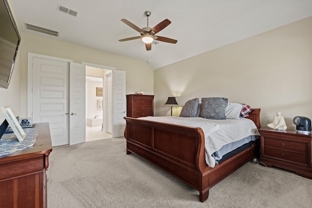 720 Serenity View Ln, Katy, TX 77493 - bedroom with visible vents, ceiling fan, ensuite bath, and light carpet