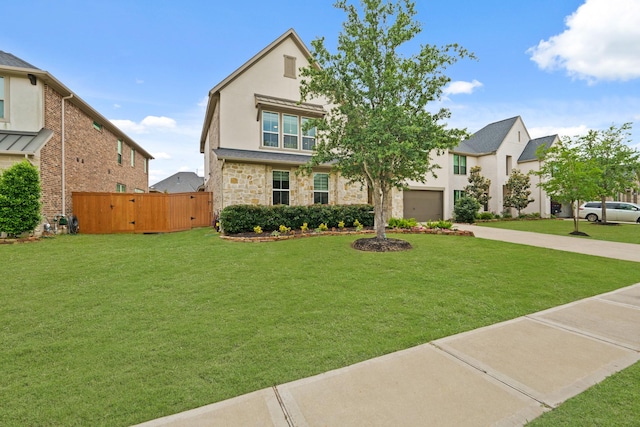720 Serenity View Ln, Katy, TX 77493 - view of front of property with a front yard, stucco siding, driveway, and stone siding