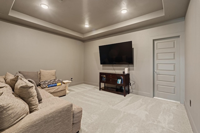 720 Serenity View Ln, Katy, TX 77493 - carpeted living room featuring a raised ceiling, baseboards, and recessed lighting