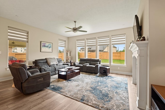 720 Serenity View Ln, Katy, TX 77493 - living room featuring ceiling fan, a healthy amount of sunlight, and wood finished floors