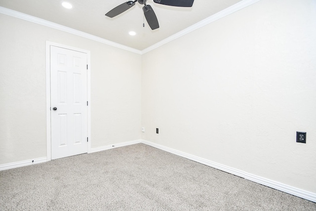 carpeted spare room featuring crown molding, a ceiling fan, baseboards, and recessed lighting