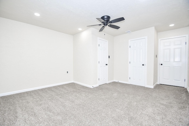 interior space featuring baseboards, carpet flooring, and recessed lighting