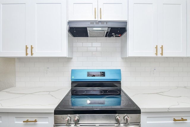 kitchen with stainless steel range with electric stovetop, under cabinet range hood, white cabinetry, and tasteful backsplash