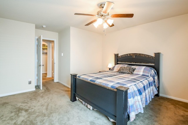 bedroom with baseboards, ceiling fan, and light carpet