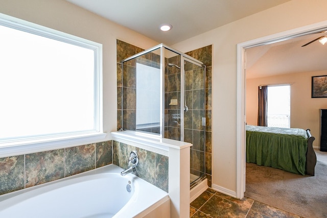 bathroom featuring baseboards, a shower stall, ensuite bathroom, and a bath