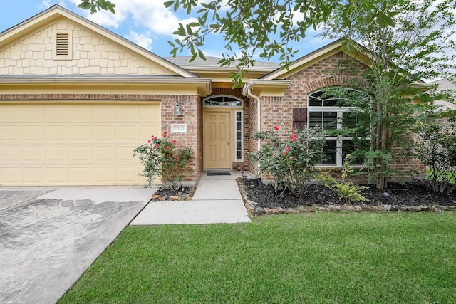 single story home featuring brick siding, a front lawn, concrete driveway, an attached garage, and a shingled roof