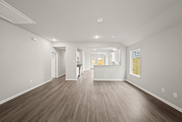 1372 Mount Blanc Path, Conroe, TX 77301 - unfurnished living room with recessed lighting, baseboards, dark wood-style floors, and visible vents